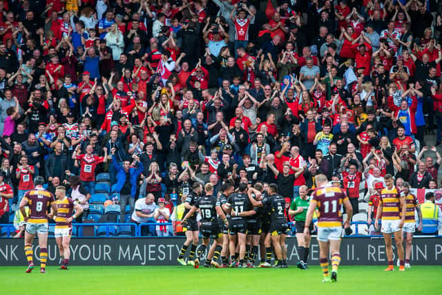 Salford Red Devils celebrate Andy Ackers' try in the closing minute. (Picture: Bruce Rollinson)