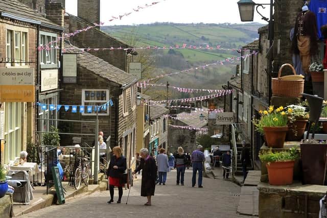 Main Street in Haworth decked in bunting to celebrate the 200th anniversary of the birth of Charlotte Brontë. (Pic credit: Tony Johnson)