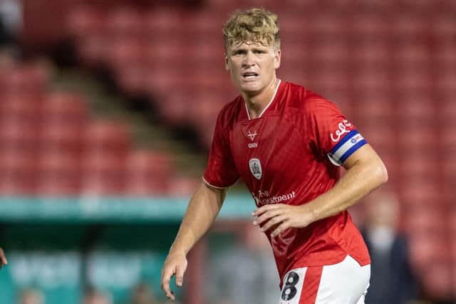 Barnsley captain Cameron McGeehan, pictured in action in the recent League One game against Blackpool. Photo: Tony Johnson.