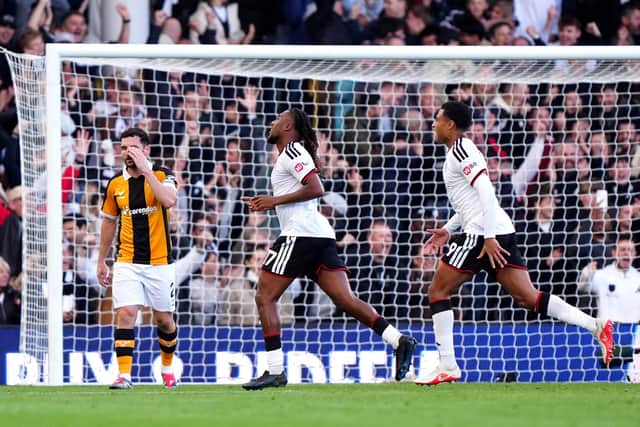 DECISIVE MOMENT: Fulham's Alex Iwobi (centre) celebrates scoring what proved to be the winning goal against Hull City. Picture: Bradley Collyer/PA.