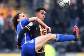 TANGLED UP: Wout Faes of Leicester City battles for possession with Hull City goalscorer Fabio Carvalho