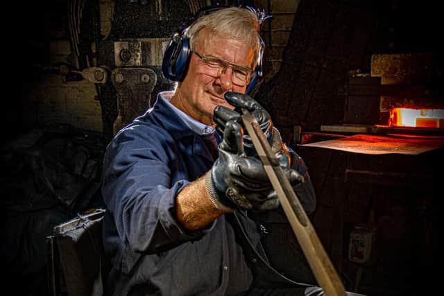 27 September 2022.....   Swordsmith Peter Hopkinson  at J. Adams Ltd in Sheffield.
Peter made the ceremonial swords used by the soldiers guarding Queen Elizabeth II coffin as she laid in state at Westminster Hall.  Picture Tony Johnson