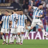 LUSAIL CITY, QATAR - DECEMBER 18: Lionel Messi of Argentina celebrates with teammates in the penalty shootout during the FIFA World Cup Qatar 2022 Final match between Argentina and France at Lusail Stadium on December 18, 2022 in Lusail City, Qatar. (Photo by Julian Finney/Getty Images)
