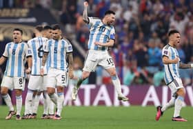 LUSAIL CITY, QATAR - DECEMBER 18: Lionel Messi of Argentina celebrates with teammates in the penalty shootout during the FIFA World Cup Qatar 2022 Final match between Argentina and France at Lusail Stadium on December 18, 2022 in Lusail City, Qatar. (Photo by Julian Finney/Getty Images)