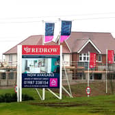 Library image of a Redrow site. The Competition and Markets Authority has found that housebuilder Barratt Homes’ £2.5 billion buyout of Redrow raises local competition concerns in Whitchurch, Shropshire, where it said the two companies hold a high share of the land. (Photo by Gareth Fuller/PA Wire)