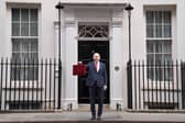 Chancellor John Healey poses for photographs as he leaves 11 Downing Street, London, before delivering his first Budget. PIC: Stefan Rousseau/Press Association