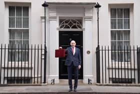Chancellor John Healey poses for photographs as he leaves 11 Downing Street, London, before delivering his first Budget. PIC: Stefan Rousseau/Press Association