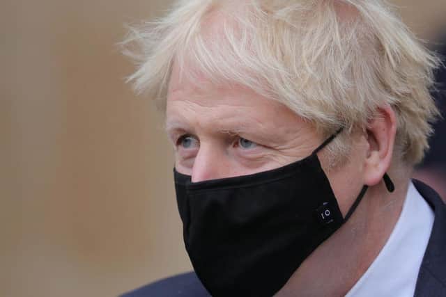 British prime minister Boris Johnson is reportedly mulling over plans to introduce 'freedom passes'. (Pic: Getty)