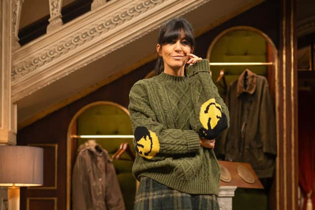 Claudia wears green cable jumper with smiley face elbows, £480 from Japanese menswear brand Kapital; kilt style skirt, £259, from Brora, which has a shop in Harrogate; and Dr Martens hi-top Chelsea boots, £180. From The Traitors II, Credit: BBC/Studio Lambert/LLARA PLAZA