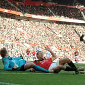 MAGIC MOMENT: Jermaine Beckford slides the ball past Manchester United goalkeeper Tomasz Kuszczak and Wes Brown to score at Old Trafford in the FA Cup in January 2010. Picture: Tony Johnson.