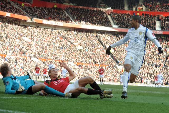 MAGIC MOMENT: Jermaine Beckford slides the ball past Manchester United goalkeeper Tomasz Kuszczak and Wes Brown to score at Old Trafford in the FA Cup in January 2010. Picture: Tony Johnson.