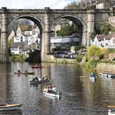 Visitors to Knaresborough enjoying a day out on the River Nidd on a rowing boat in the spring sunshine