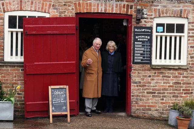 King Charles III and the Queen Consort during their visit to Talbot Yard Food Court in Yorkersgate, Malton, North Yorkshire, where they met food and drink producers with shops and heard more about their locally produced goods. Picture date: Wednesday April 5, 2023.