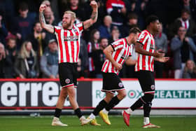 ON A ROLL: Sheffield United's Oli McBurnie (left) celebrates scoring against Championship rivals Birmingham City at Bramall Lane on Saturday. Picture: Isaac Parkin/PA