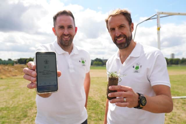 Karl Standley, grounds manager at Wembley Stadium, and Gareth Southgate, England men's football manager, launch the PitchPower app developed by digital agency Bolser  ( Football Foundation)