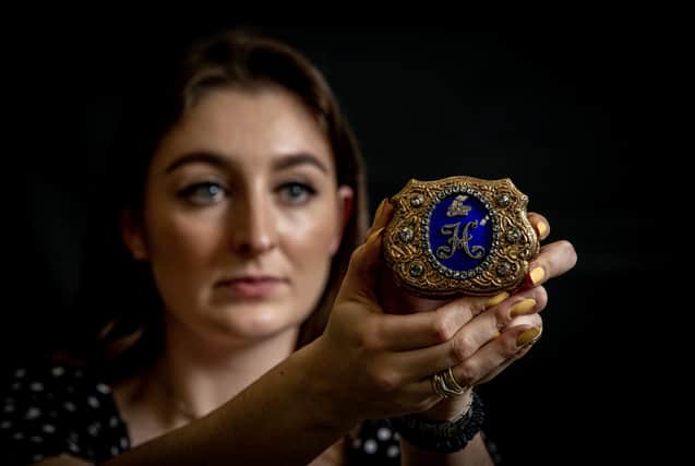 Julia Matyear with a diamond , gold and enamel Royal presentation snuff box with the Imperial Russian crown for Nicholas I estimated at £25,000  photographed for the Yorkshire Post by Tony Johnson.