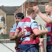 One last job: Rotherham Titans players celebrate a try in one of the 24 wins they have earned that have taken them to the brink of the title.