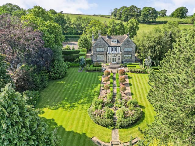 An aerial view of Craigens, Dawcross Rise, near Burn Bridge on the southern outskirts of Harrogate. It is set in 1.52 acres of beautifully landscaped gardens with rear lawn, orchard and tennis court, and on the market for offers over £2.1 million, with Strutt & Parker.