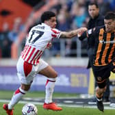 HULL, ENGLAND - MARCH 29: Anass Zaroury of Hull City is challenged by Ki-Jana Hoever of Stoke City during the Sky Bet Championship match between Hull City and Stoke City at MKM Stadium on March 29, 2024 in Hull, England. (Photo by George Wood/Getty Images)