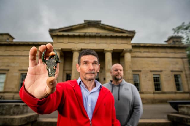 Mark Didlick, left, holding one of his finds a Bovine Bucket Mount, Iron Age, found in a field near Thirsk, North Yorkshire, with James Sparks, right, both were responsible for discovering the very high profile North Yorkshire hoard, pictured at the Yorkshire Museum, York. Picture By Yorkshire Post Photographer,  James Hardisty.