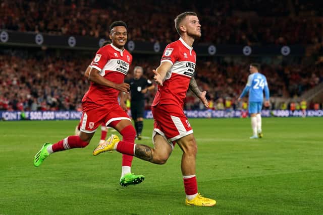 Middlesbrough's Riley McGree celebrates scoring their side's first goal of the game with team-mate Rodrigo Muniz during the Sky Bet Championship match at the Riverside Stadium, Middlesbrough.