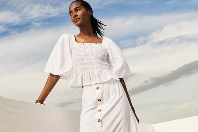 Fashion brand Next has revealed that warmer weather and continued wage increases have sparked a jump in sales in recent weeks.