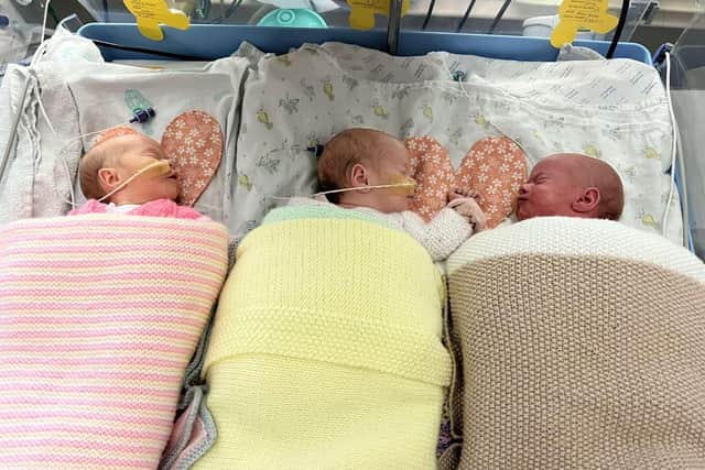 Pictured (L-R) Thea, Lily, Esmae. A set of adorable identical triplets who doctors said were all boys turned out to be all girls - and they have finally been reunited for the first time since their birth.