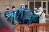 Passengers are disembarked from the hantavirus-stricken cruise ship MV Hondius at the port of Granadilla in Tenerife, Canary Islands. PIC: AP Photo/Manu Fernandez