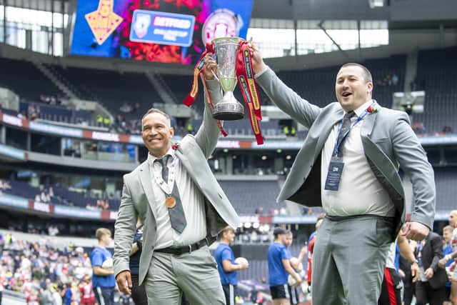 Chris Chester, right, holds the 1895 Cup aloft with Adrian Lam in 2022. (Photo: Allan McKenzie/SWpix.com)