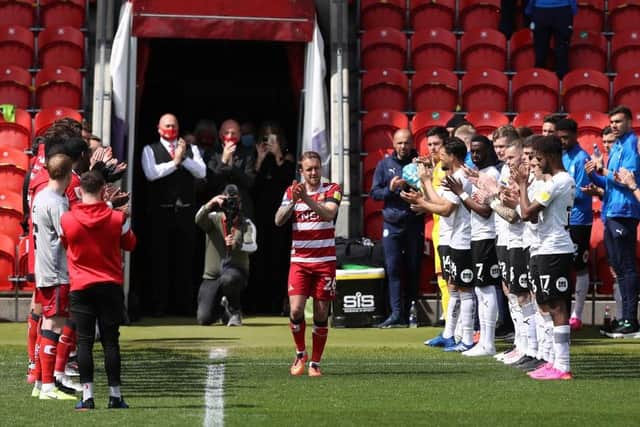 CLUB LEGEND: James Coppinger walks out to a guard of honour for his last Doncaster Rovers appearance