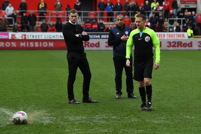 Rotherham United v Cardiff City. Referee Oliver Langford tests the pitch with Matt Taylor and Sabri Lamouchi. Picture: Jonathan Gawthorpe.