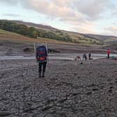 Members of Edale Mountain Rescue are pictured helping a stricken walker from the mud at Ladybower reservoir. Pictures: Edale Mountain Rescue