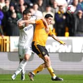DEFENSIVE GIANT: Max Wober of Leeds United battles with Wolverhampton Wanderers striker Raul Jimenez (right)