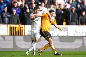 DEFENSIVE GIANT: Max Wober of Leeds United battles with Wolverhampton Wanderers striker Raul Jimenez (right)