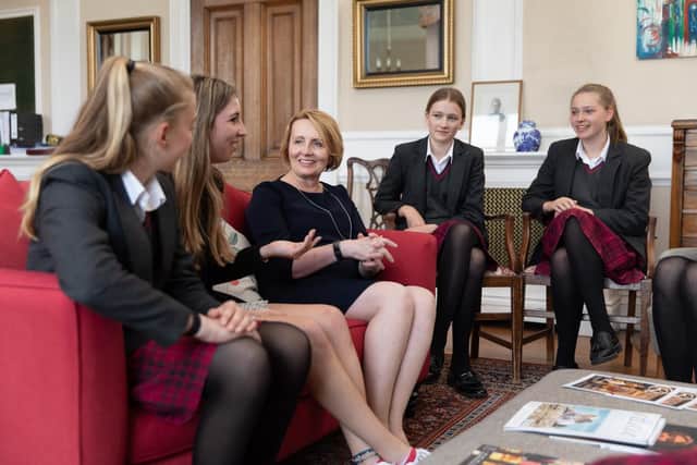 Head, Sue Baillie, chats to her students at Queen Margaret’s School for Girls in Escrick, York.