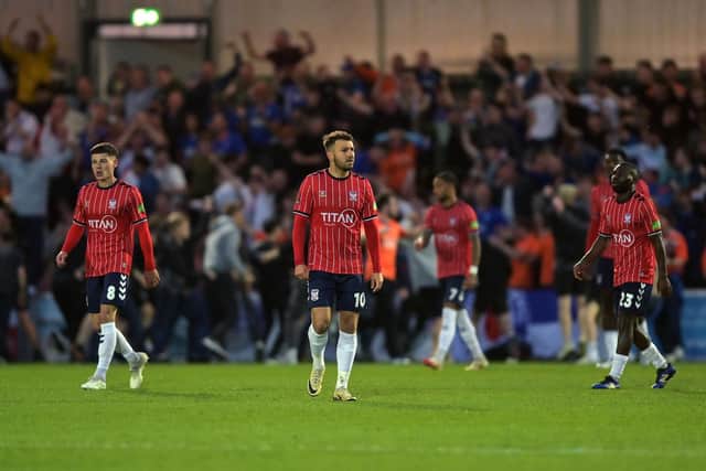 York City's crestfallen players after Oldham's third goal. Picture: Jonathan Gawthorpe