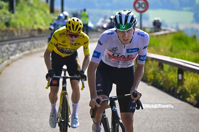 UAE Team Emirates' Slovenian rider Tadej Pogacar (R) wearing the best young rider's white jersey cycles ahead of Jumbo-Visma's Danish rider Jonas Vingegaard (L) wearing the overall leader's yellow jersey in the ascent of the Puy de Dome in the final kilometers of the 9th stage of the 110th edition of the Tour de France (Picture: BERNARD PAPON/POOL/AFP via Getty Images)