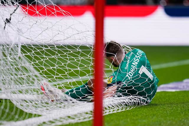 Rotherham United goalkeeper Viktor Johansson falls into his own net during the Sky Bet Championship matchwith Millwall (Picture: PA)