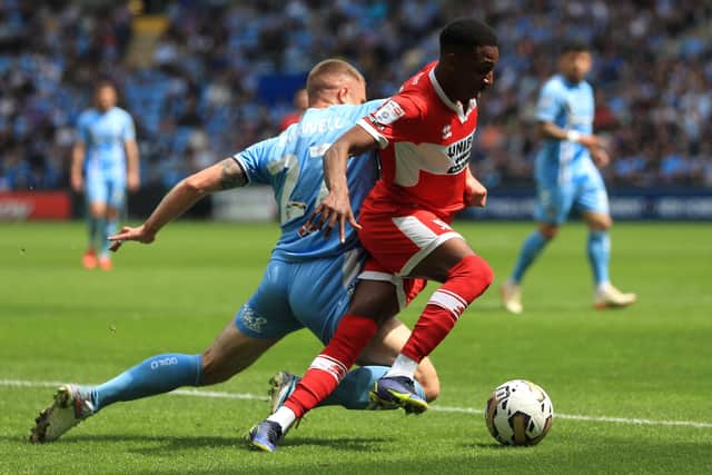 THREAT: Middlesbrough's Isaiah Jones (right) takes on Coventry City wing-back Jake Bidwell