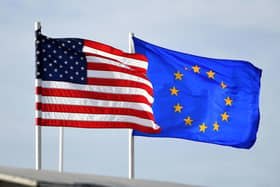 The American and European flag flying together. PIC: Anthony Behar/PA Wire.