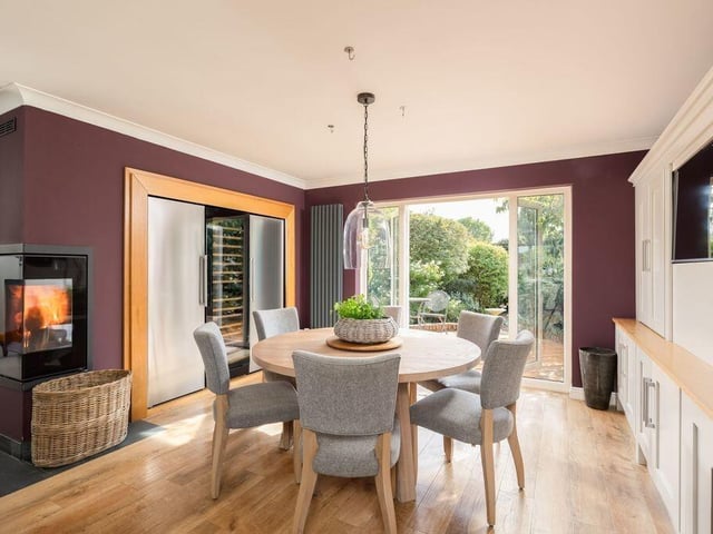 A contemporary woodburner creates a cosy focal point.