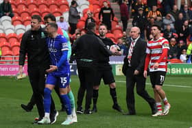 RED MIST: Bradford City's Aden Baldwin (No 15) is sent off by referee Ross Joyce in the crunch promotion game at Doncaster Rovers (Image: Jonathan Gawthorpe)