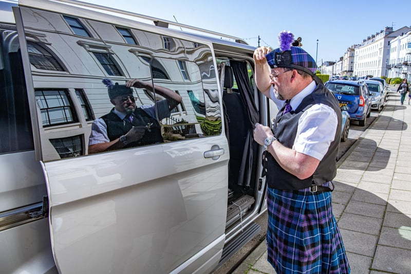 Colin Marris uses the reflection from his van to get ready