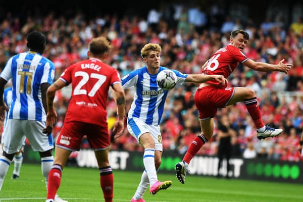 Middlesbrough v Huddersfield Town. Boro's Jonny Howson takes on Town's Jack Rudoni. Picture: Jonathan Gawthorpe.
