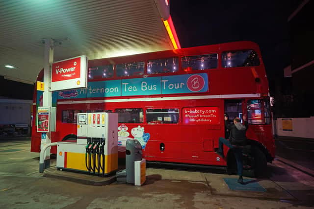 Energy giant Shell has said it saw earnings from its gas trading business jump in the latest quarter but this was partly offset by weakness in its chemicals arm. Library image of a  bus being refuelled at a Shell petrol station in London. (Photo by Yui Mok/PA Wire)