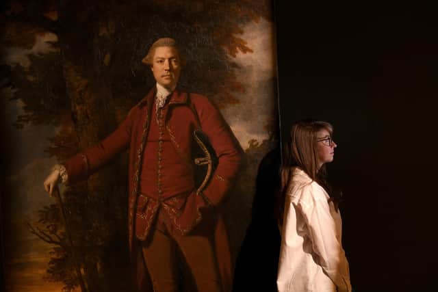 To mark 300 years since the birth of renowned eighteenth-century painter and co-founder of the Royal Academy Joshua Reynolds, Harewood House Trust is launching a brand-new exhibition for 2023, exploring his work and role in constructing power and identity through portraiture in the age of Empire. Curator and Archivist Rebecca Burton pictured with the painting of Edwin Lascelles by Sir Joshua Reynolds Yorkshire Post Photographer Simon Hulme