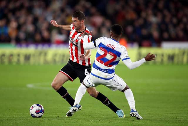 Sheffield United's Chris Basham (left) and Queens Park Rangers' Kenneth Paal battle for the ball during the Sky Bet Championship match at Bramall Lane. Picture: PA.