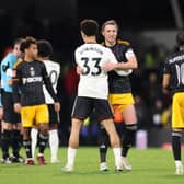 LONDON, ENGLAND - FEBRUARY 28: Antonee Robinson of Fulham embraces Luke Ayling of Leeds United after the Emirates FA Cup Fifth Round match between Fulham and Leeds United at Craven Cottage on February 28, 2023 in London, England. (Photo by Warren Little/Getty Images)