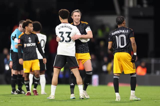 LONDON, ENGLAND - FEBRUARY 28: Antonee Robinson of Fulham embraces Luke Ayling of Leeds United after the Emirates FA Cup Fifth Round match between Fulham and Leeds United at Craven Cottage on February 28, 2023 in London, England. (Photo by Warren Little/Getty Images)