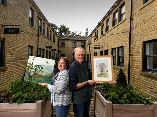 Artists Steven Spencer and Sue Sands pictured with their artwork  from the exhibition 'To Everything a Season' at the South Square Centre, Thornton Bradford. Picture by Simon Hulme, 3rd October 2022